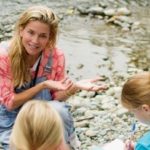 Patsy Collins award recipient Elizabeth Wing teaching students near the water.
