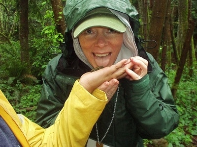 Chief Financial Officer/Chief Operating Officer Laurie Miller, sticking out her tongue to lick a slug.